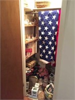 contents of entryway closet : flag, misc decor