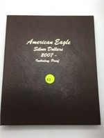 AMERICAN SILVER EAGLE BOOK WITH 7 SILVER EAGLES