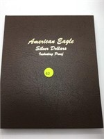 AMERICAN SILVER EAGLE BOOK WITH 9 SILVER EAGLES