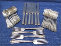 fancy plated flatware in plated shell dish