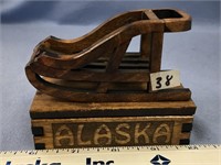Carved Alaskan box with a dog sled on top        (