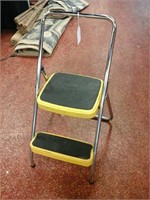 Yellow metal folding step stool