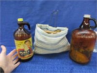2 old amber bottles & 109 clothes pins in holder