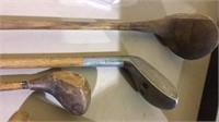 Three old wood shaft golf clubs, one marked