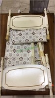 Vintage doll bed about 24 inches long , 12 inches