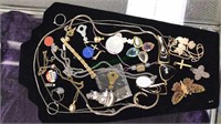 Costume jewelry including brooches, religious