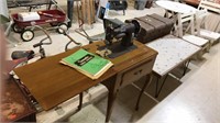 Domestic sewing machine and a Queen Anne walnut
