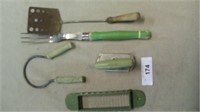 green handled kitchen utensils and a butter slicer
