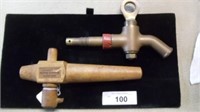 wood barrell tap and a brass barrell tap