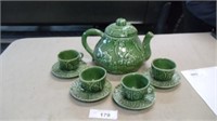 Tea set made in Portugal with 1 pot, 4 cups and 4