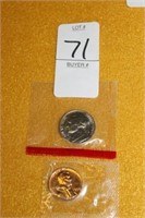 TWO UNCIRCULATED COINS