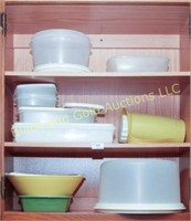 Three shelves of Rubbermaid storage containers