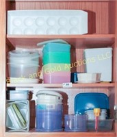 Three shelves of plastic storage containers