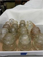 Collection of 16 antique clear glass insulators,