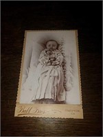 Postmortem antique photo of a small infant in her