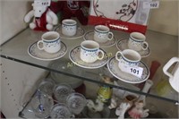 DEMITASSE CUPS AND SAUCERS