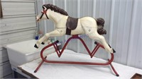 Old plastic glider horse