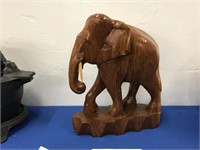 LIGHTLY LACQUERED CARVED WOOD ELEPHANT