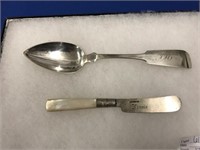 AN ANTIQUE AMERICAN COIN SILVER TABLESPOON BY