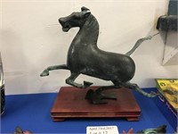 PATINATED METAL TANG HORSE SCULPTURE ON WOODEN