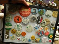 VINTAGE PINBACK BUTTONS IN A DISPLAY CASE