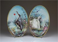 PAIR OF HAND PAINTED PORCELAIN PLAQUES