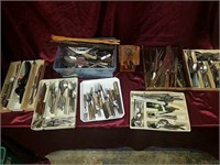 Large assortment of flatware and knives