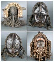 4 Dan style masks. 20th century.