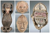 Four West African masks and figure. 20th century.