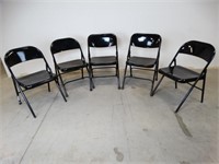 Five Black Metal Folding Chairs