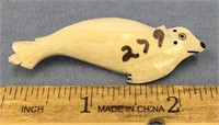 2 1/2" carved ivory seal pin, has scrimmed detail