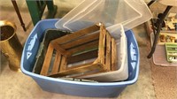Four hard plastic tubs , one lid, and a wood