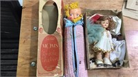 Two dolls, , one rolling skating and one moms
