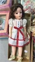 Vintage doll in  original clothing and shoes,