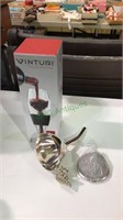 Wine funnel with screen and a red wine aerator in