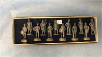 12 pewter soldier figures, About 2 inches tall