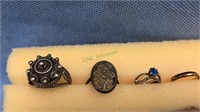 4 rings , 2 children's ring and 2 ornate