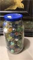 Jar of marbles including a shooter might be