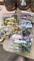 Seven bags with Legos kits including mission