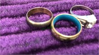 Three rings including one that's cloisonné