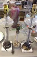 Three glass electric lamps , two are matching and