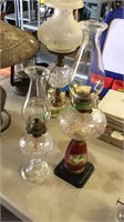 To antique glass oil lamps both with shades, one