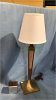 Modern wood stem lamp with a metal base and a Vox