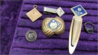 Six Cub Scout pieces including a money clip, tie