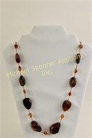 GRADUATED AMBER NECKLACE WRAPPED IN GOLD TWINE