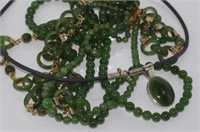 Four various green stone necklaces