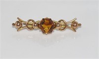 Vintage 9ct gold bar brooch with golden stone