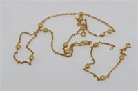 18ct yellow gold necklace with interspersed balls