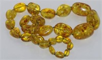 Matinee length yellow-green Baltic amber necklace