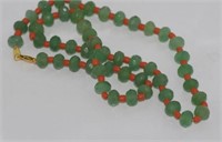 Green stone and coral necklace